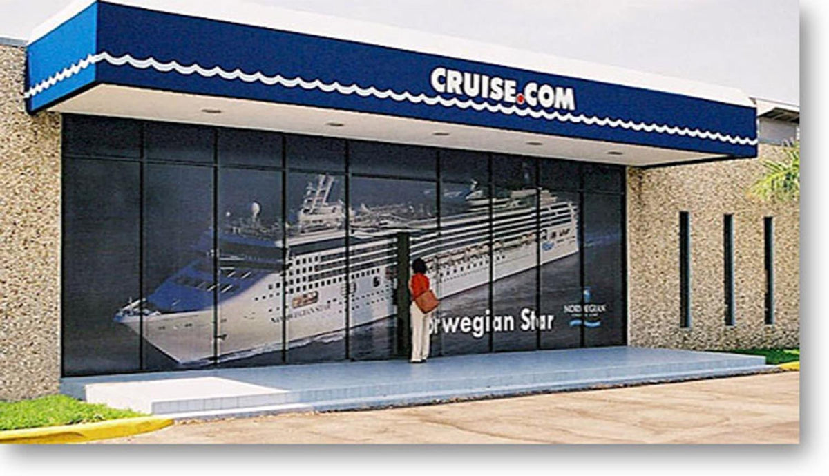 Storefront with one-way window film showcasing cruise ship, enhancing privacy and aesthetics.