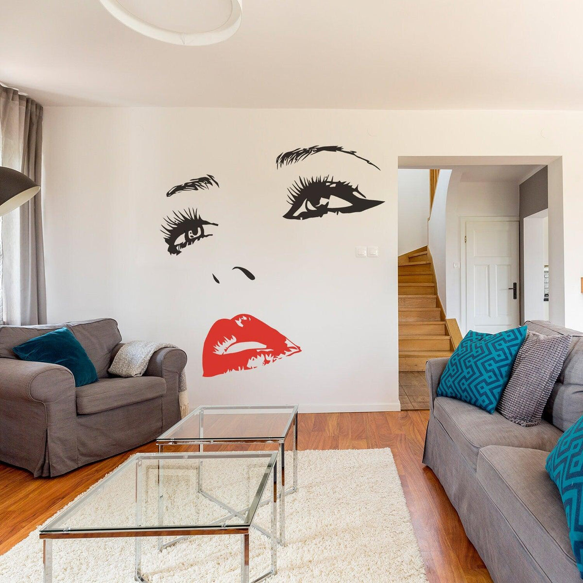 Elegant black and red woman face vinyl sticker on white wall in modern living room decor.