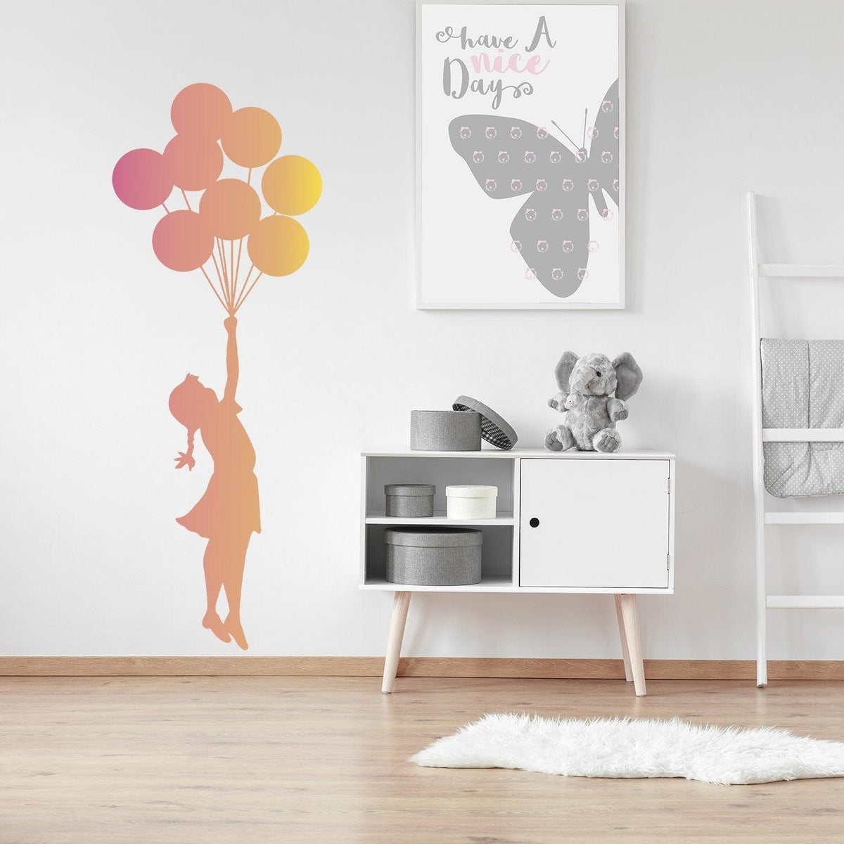 Balloon girl wall sticker in a nursery with colorful balloons.