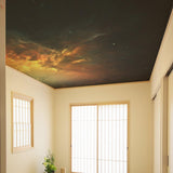 Space theme ceiling vinyl sticker with galaxy art creating a dreamy atmosphere in a bright room.