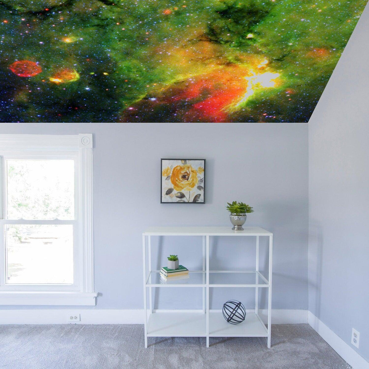 Colorful space-themed ceiling vinyl sticker featuring a galaxy design in a bedroom.