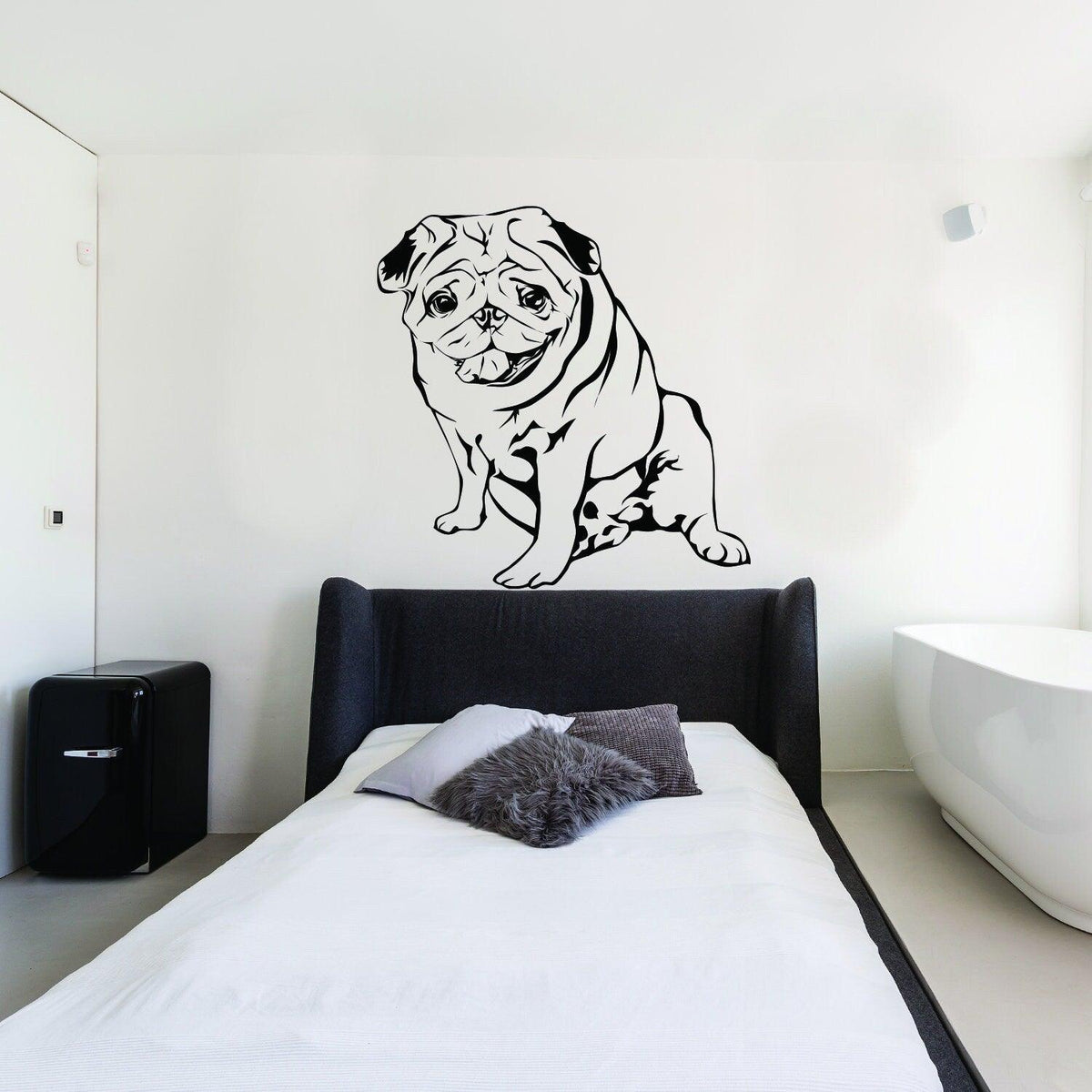 Custom vinyl wall decal of a pug dog accenting a modern bedroom decor.