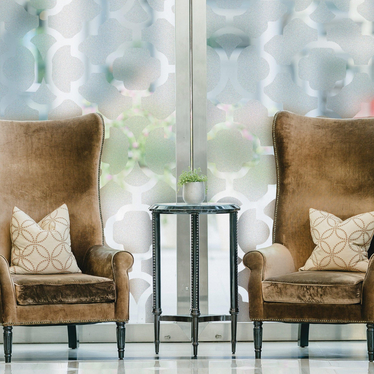 Frosted door film privacy vinyl decal creating elegant ambiance, showcasing stylish chairs and table in bright room.