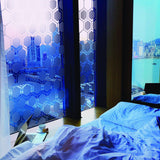 Stylish frosted glass window decal featuring a honeycomb pattern in a modern bedroom setting.
