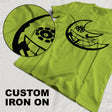 Custom iron on transfer t-shirt with unique black design on vibrant green fabric.