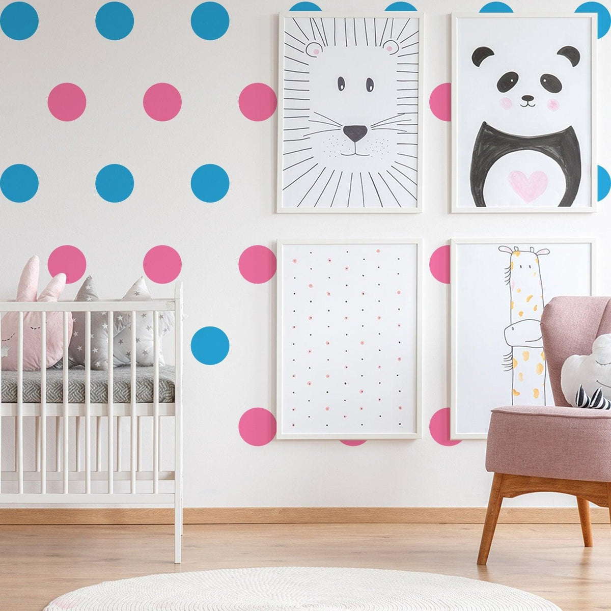 Colorful kids room with blue and pink vinyl wall decals, framed animal art, and a cozy crib for nursery decor.