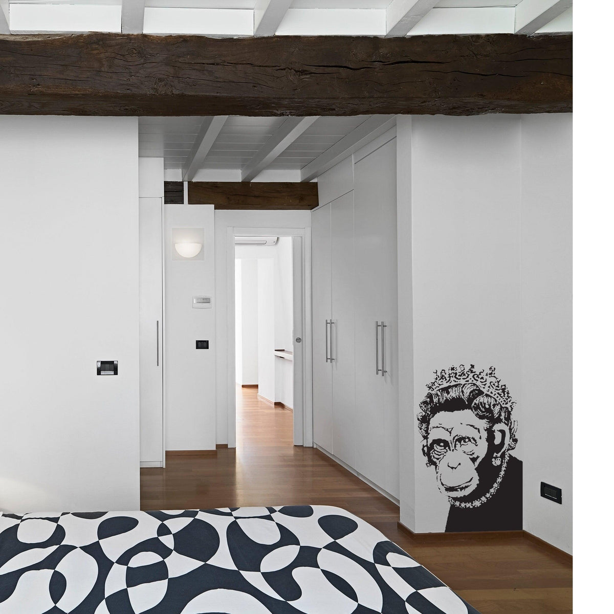 Street art monkey queen wall sticker displayed in a modern bedroom.