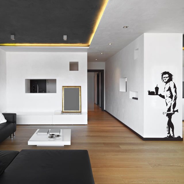 Caveman street art wall decal in a modern interior.
