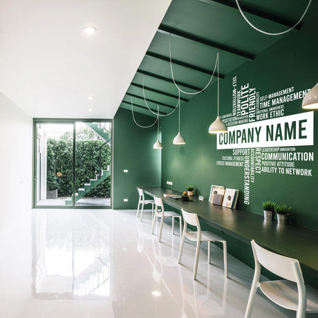 Modern office featuring a green wall with customizable business name vinyl sticker and sleek furniture.