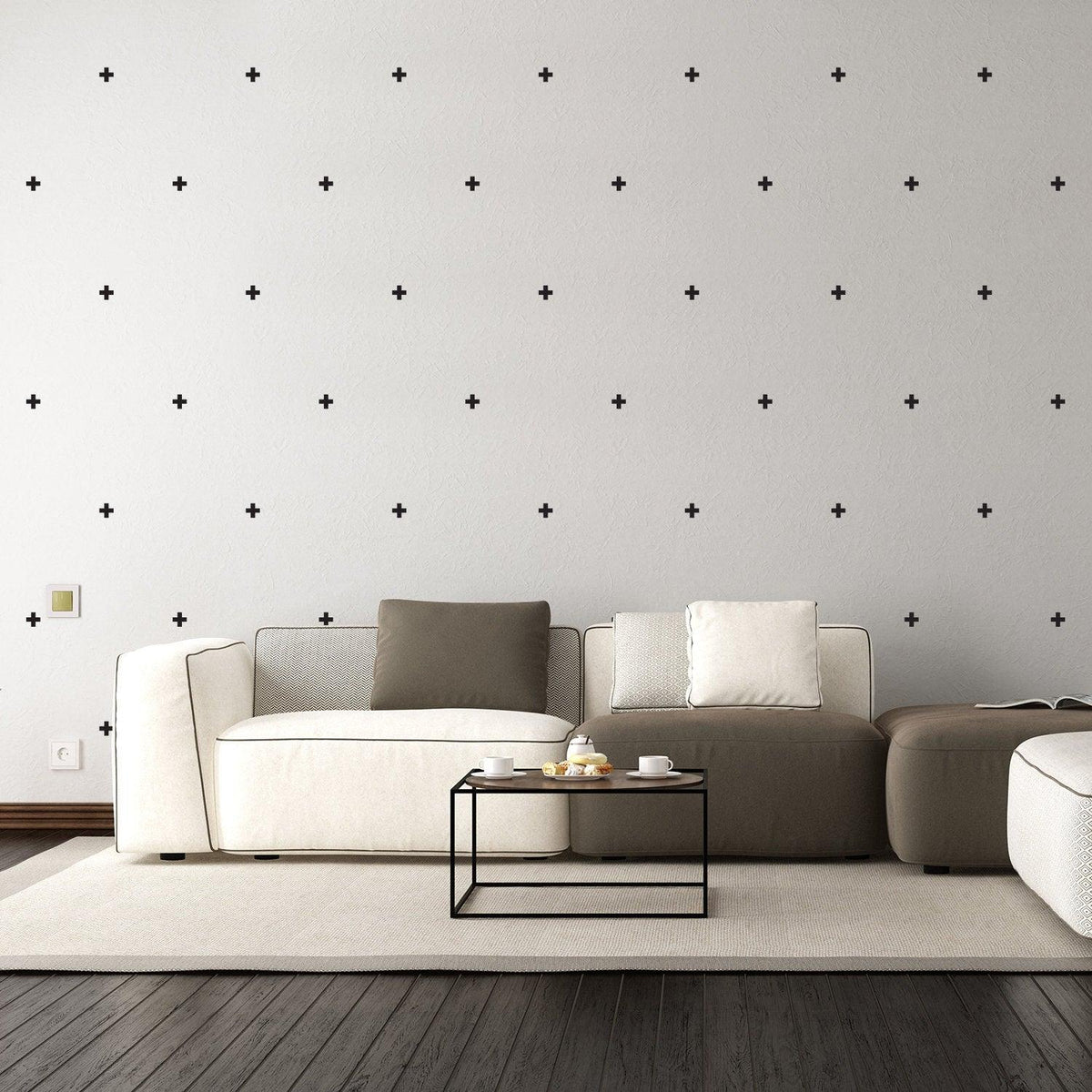 Stylish living room featuring 50x Cross Sticker Vinyl Wall Decor in black on a gray wall above a modern sofa.