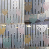 Custom frosted window film decal featuring cute owl designs in pastel colors for glass doors.