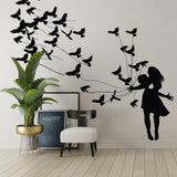 Kissing wall decal featuring silhouettes of a couple and birds.