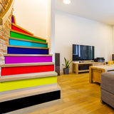 Vibrant rainbow self-adhesive stairs risers stickers on modern staircase, enhancing home decor.