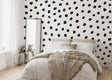 Modern bedroom featuring black polka dots wall decal, adding playful decor to the stylish space.