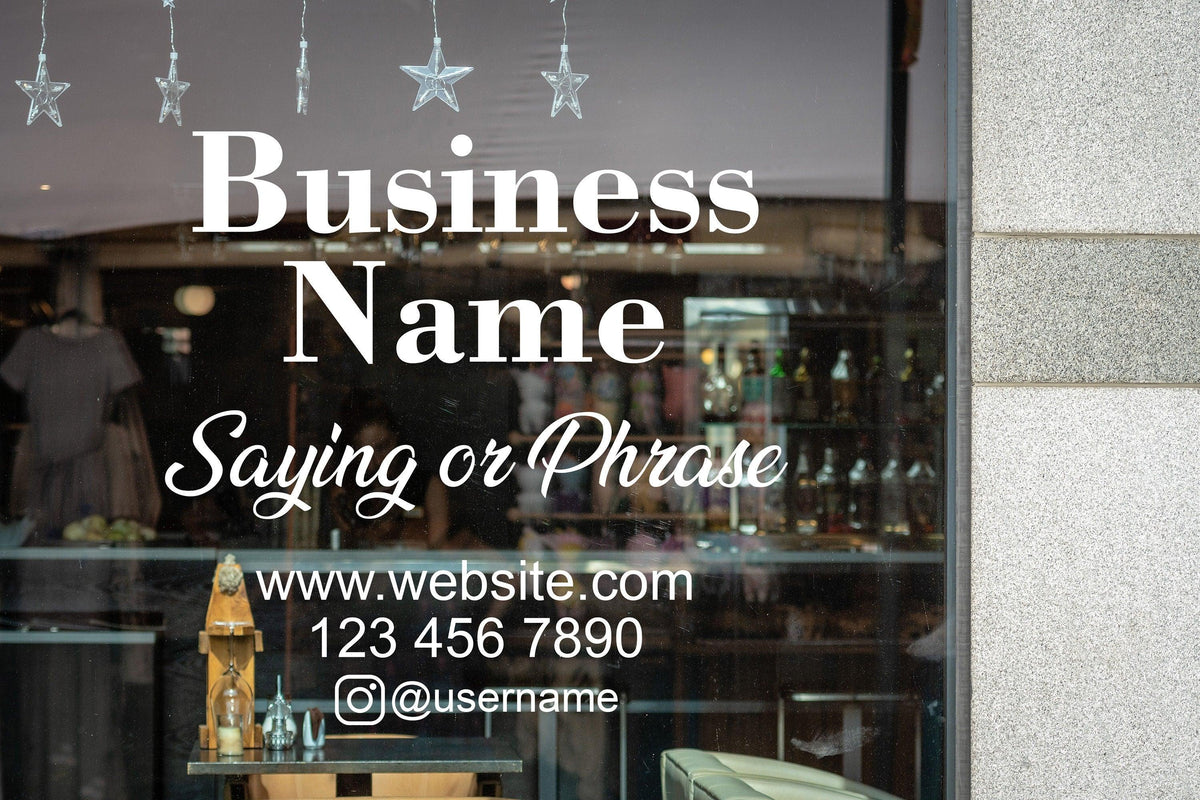 Custom window decal featuring business name, contact info, and a catchy phrase on storefront glass.