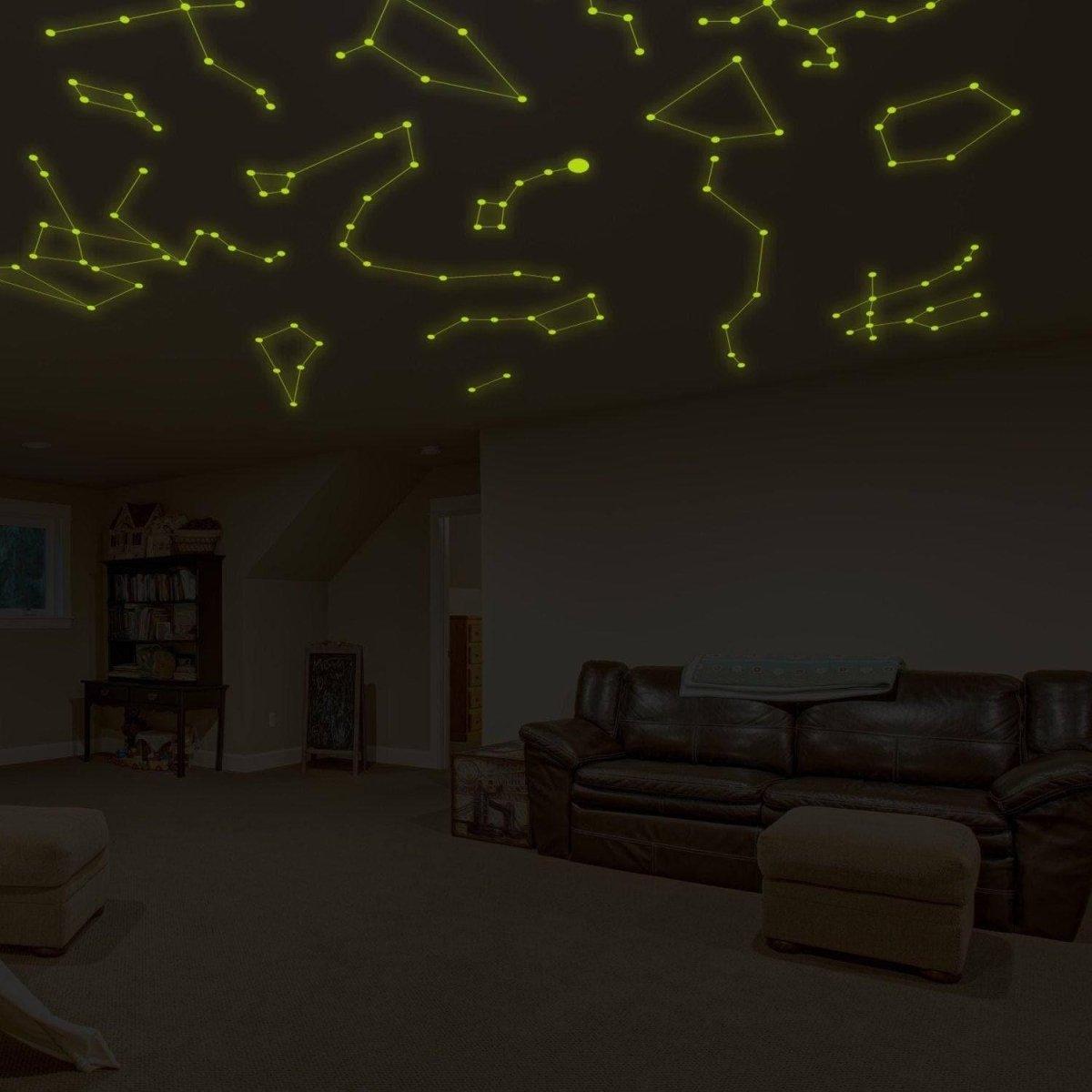 Glow-in-the-dark wall decals showcasing constellations on a ceiling in a cozy living room.