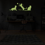 Glow in the dark feline wall decal featuring playful cats.