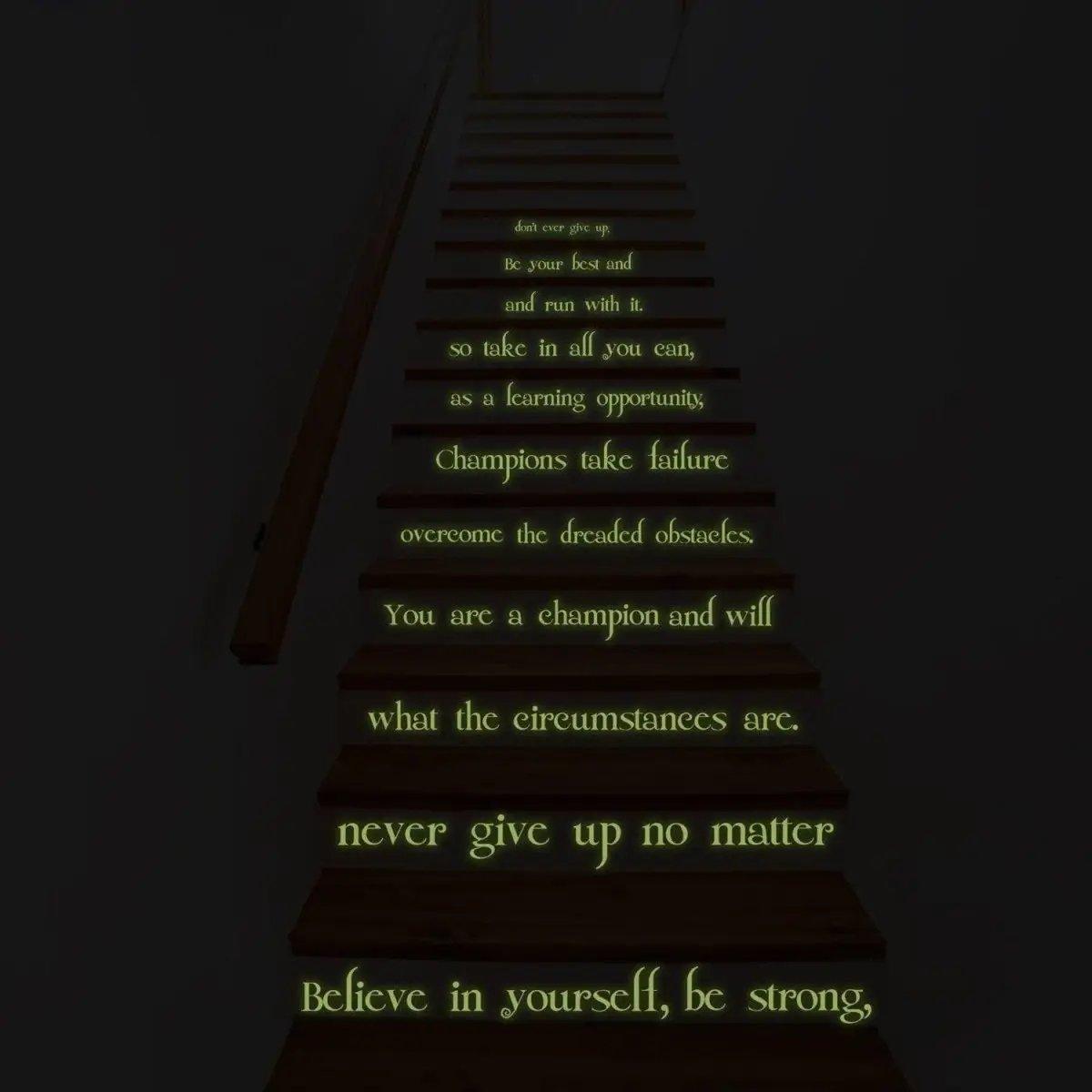 Glow in the dark motivational quote sticker on staircase, inspiring words to 'believe in yourself' and overcome challenges.